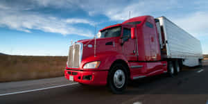 A Low Truck Parked Alongside The Road. Wallpaper