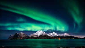 A Magical Dance Of The Northern Lights In The Night Sky Wallpaper