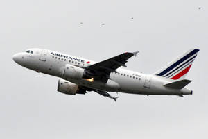 A Majestic Air France Airbus A380 Soaring In The Sky Wallpaper