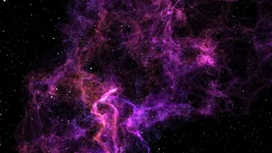 A Majestic And Captivating Black And Purple Galaxy Wallpaper