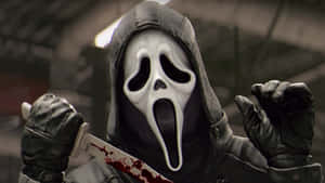 A Man In A Mask Holding A Knife Wallpaper