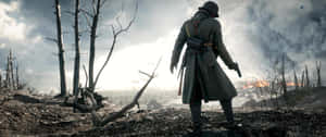 A Man In A Trench Coat Is Standing In Front Of A Fire Wallpaper
