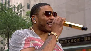 A Man In Sunglasses Is Holding A Microphone Wallpaper