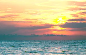 A Man Is Riding A Surfboard In The Ocean Wallpaper