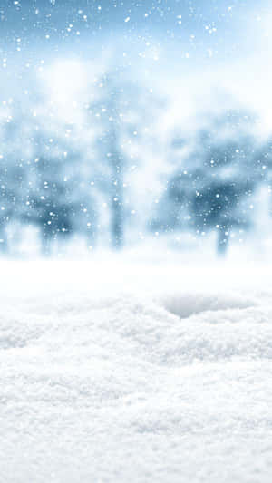 A Man Is Standing In The Snow With A Snow Shovel Wallpaper