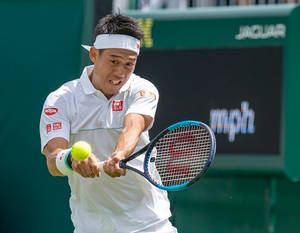 A Man Playing Tennis Wallpaper