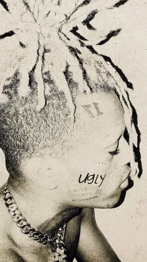 A Man With Dreadlocks On His Head Wallpaper