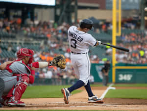 A Moment Of Action In A Baseball Game Wallpaper