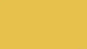 A Pastel Yellow Laptop On A White Background Wallpaper