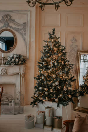 A Peaceful And Festive Christmas Tree Lit Up By Glowing Blue And White Lights Wallpaper