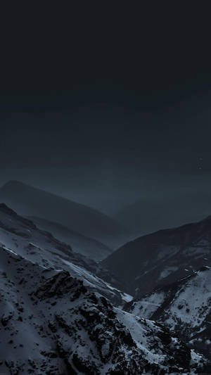 A Peaceful Night Surrounded By Mountain Landscapes Wallpaper