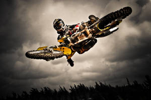 A Person Riding A Dirt Bike Wallpaper