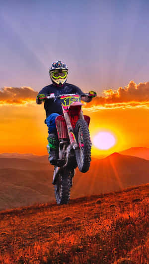 A Person Riding A Dirt Bike Wallpaper