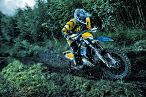 A Person Riding A Dirt Bike Wallpaper