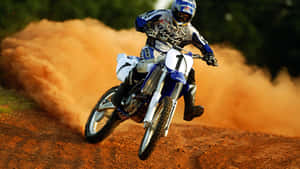 A Person Riding A Dirt Bike Wallpaper