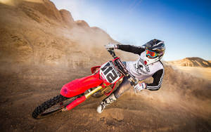 A Person Riding A Dirt Bike Wallpaper