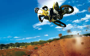 A Person Riding A Dirt Bike Wallpaper