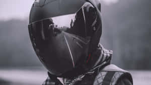 A Person Wearing A Helmet On A Road Wallpaper