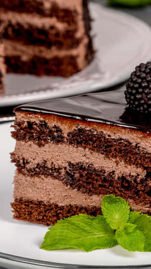 A Piece Of Chocolate Cake With Blackberries On A Plate Wallpaper