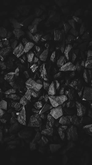 A Pile Of Black Stones Wallpaper