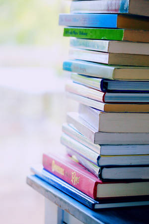 A Pile Of Knowledge - Stack Of Books Wallpaper