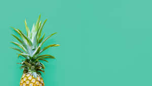 A Pineapple On A Turquoise Background Wallpaper