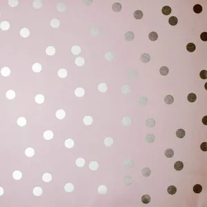 A Pink And Silver Polka Dot Fabric Wallpaper