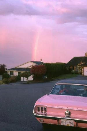 A Pink Car Parked In A Driveway Wallpaper
