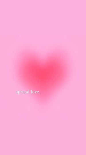 A Pink Heart With The Words Spread Love Wallpaper