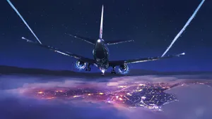 A Plane Flying Over A City Wallpaper