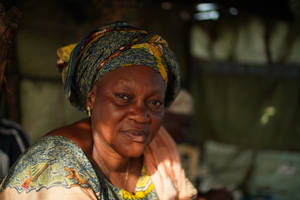 A Portrait Of Grace - Elderly Woman With Traditional Head Tie Wallpaper