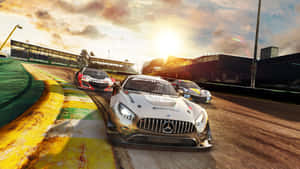 A Race Car Driving On A Track Wallpaper