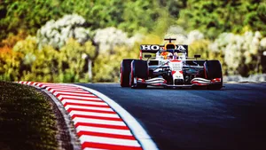 A Race Car On A Track Wallpaper