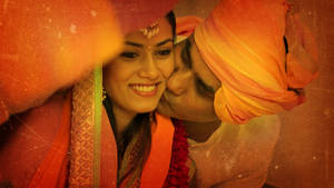 A Rajputana Romance - Man Kissing Woman In Traditional Attire Wallpaper
