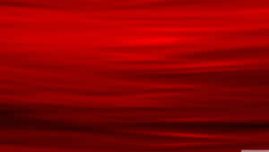 A Red Abstract Background With Waves Wallpaper