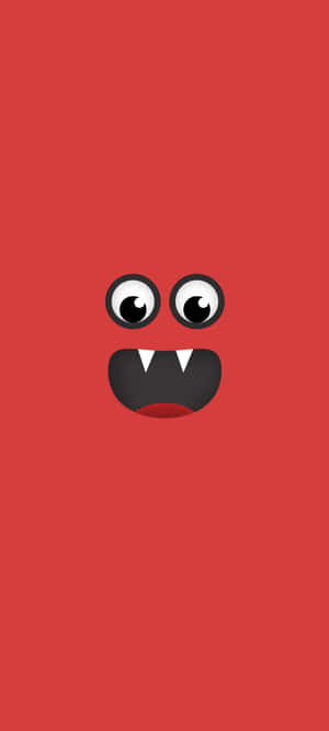 A Red Monster Face With Black Eyes Wallpaper