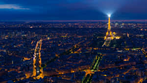 A Romantic View Of Paris At Night Wallpaper