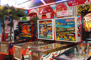 A Room Full Of Pinball Machines Wallpaper