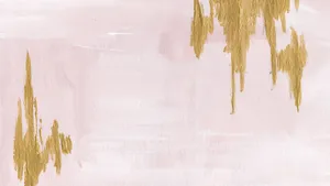 A Rose Gold Laptop On The Desk Of A Busy Professional Wallpaper