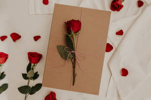 A Rose In An Envelope Exudes A Sweet Scent Of Love Wallpaper