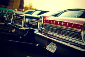 A Row Of Cars Parked In A Parking Lot Wallpaper