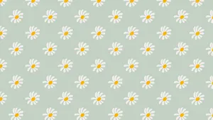 A Sage Green Laptop Sitting On A Desk Wallpaper