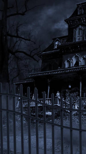 A Scary House With A Fence And A Clock Wallpaper