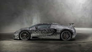 A Silver Bugatti Veyron C7 Sat In A Dark Room Wallpaper