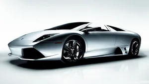 A Silver Sports Car Is Shown In A White Background Wallpaper