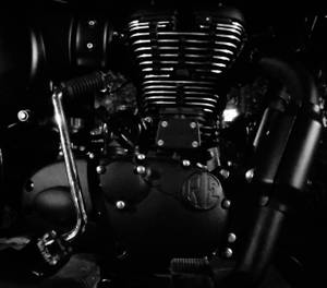 A Single Engine Motorcycle Oozing Strength And Power. Wallpaper