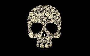 A Skull With Floral Designs On A Black Background Wallpaper