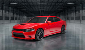 A Sleek, Black Dodge Charger Speeds Down An Open Highway, Showcasing Its Powerful Design And Performance. Wallpaper