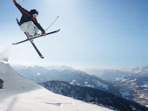 A Snowy View Of The Ski Mountain Wallpaper