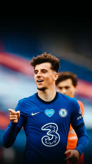 A Soccer Player Is Standing On The Field Wallpaper